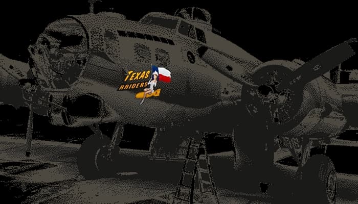 Nose art on a World War II plane. A woman riding a bomb while holding a flag.